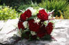 Red rose and ivory freesia handtied bride's bouquet